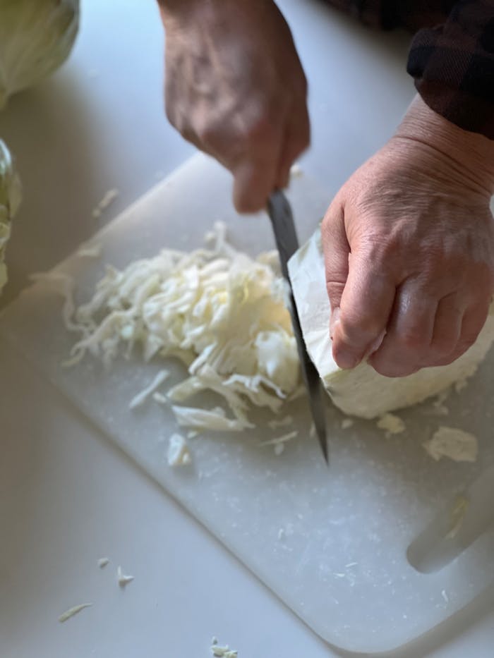 chopping cabbage on cutting board close up 29025986