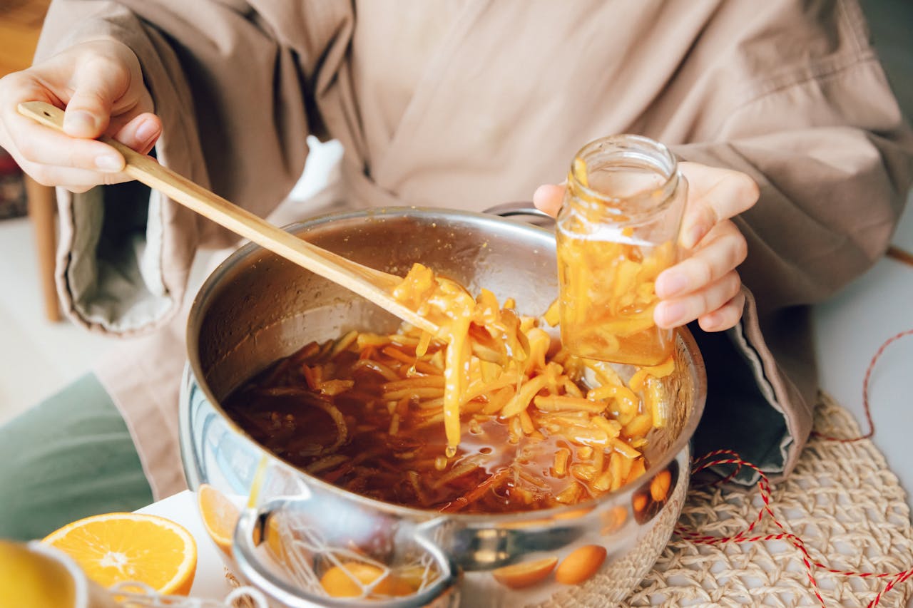 cooking fruits in metal pot 6588494